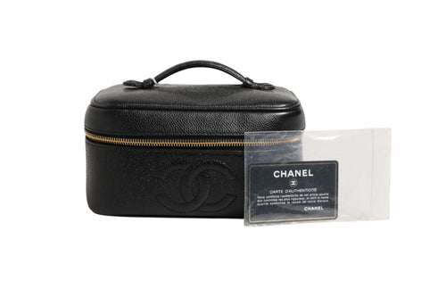 Chanel svart og gull sminkeveske